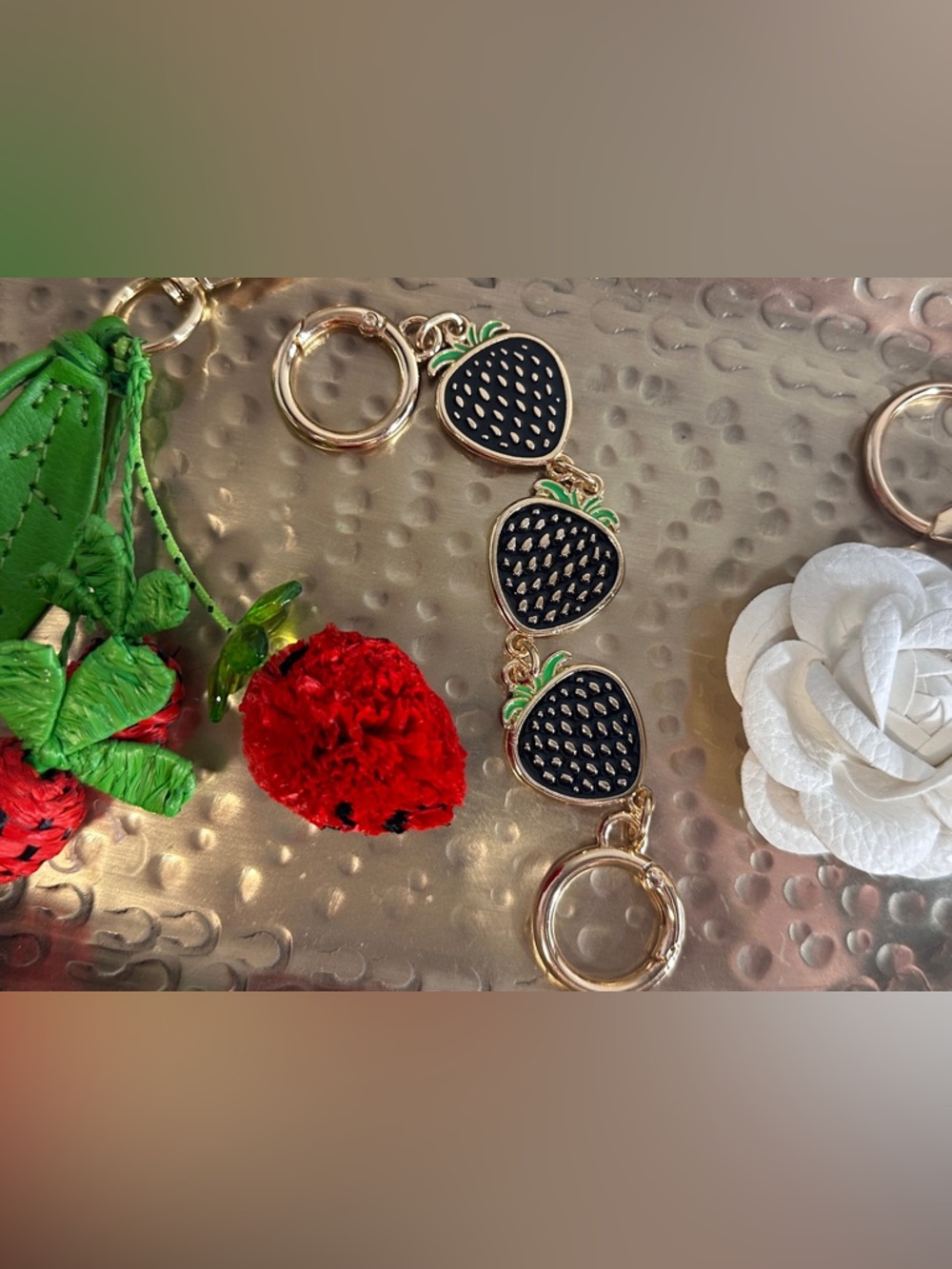 Three bag charm set. Leather flower, bag extender and charm with strawberries.